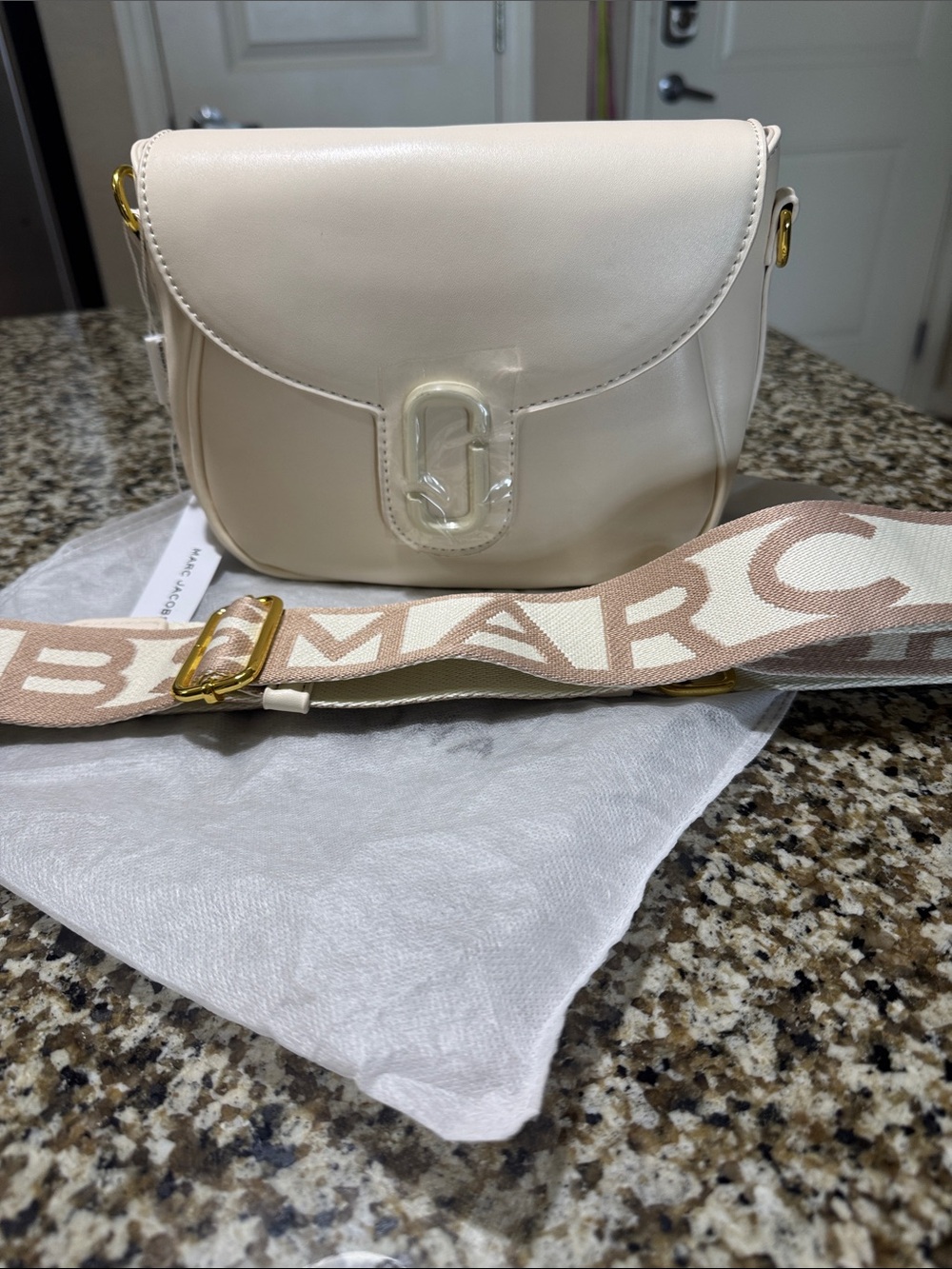 Cream Crossbody Saddle Bag with Adjustable Logo Strap